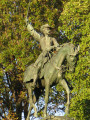 Equestrian figure on pedestal embellished with relief eagle on front, four medallions (two on each side)