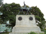 Equestrian figure on pedestal embellished with relief eagle on front, four medallions (two on each side)