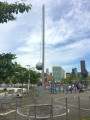 Large-scale steel tetherball with painted line drawing of ball movement on the ground.