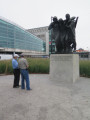 Group of three figures (heroic scale), integral plinth, on pedestal