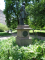 Portrait statue on pedestal with medallions