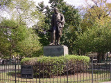 Standing figure (heroic scale) on integral plinth on pedestal