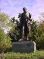 Standing figure (heroic scale) on integral plinth on pedestal