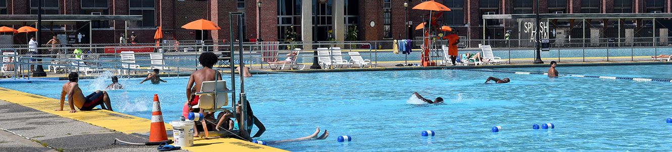 People using a city pool.