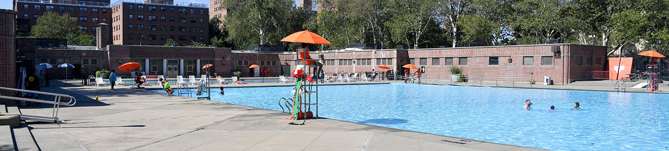 A lifeguard looking out at a city pool.