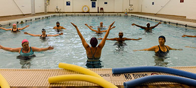 Rec center members participate in an adaptive swim class