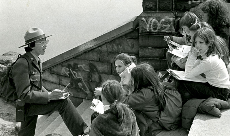 An Urban Park Ranger instructs a class on the steps of Belvedere Castle.