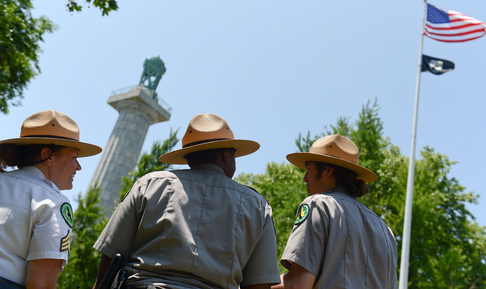 Urban Park Rangers facing Fort Greene Park monuments