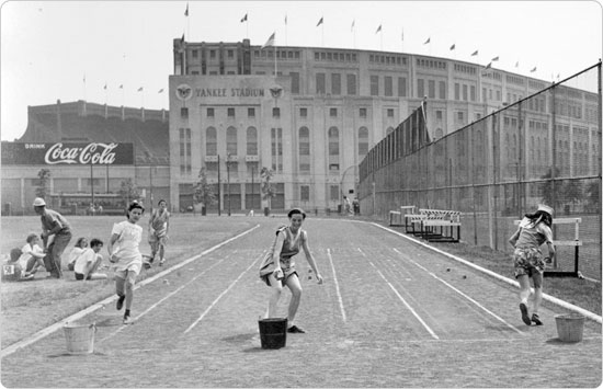 Image of Girls race at McCombs Dam Park, in front of Yankee Stadium, on February 10, 1947. Neg. 24977