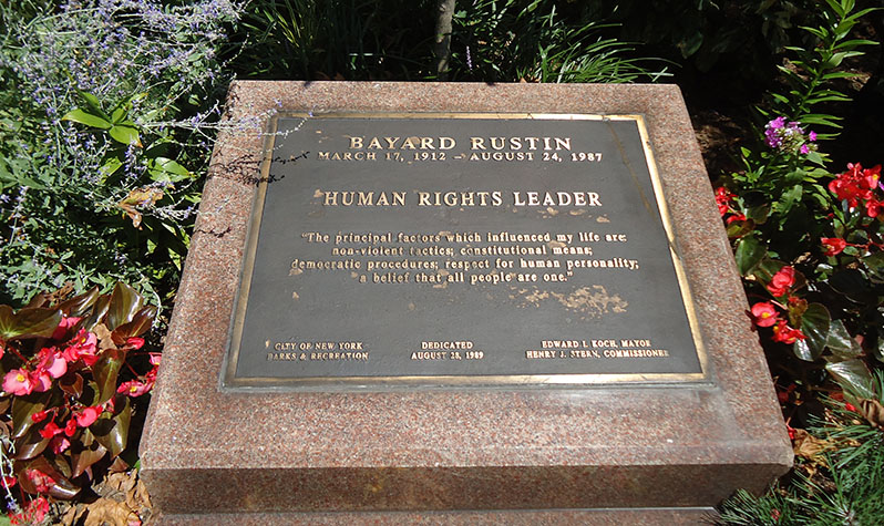 A plaque in a garden area in the park reads: Bayard Rustin, March 17, 1912 to August 24, 1987, Human Rights Leader, The principal factors which influenced my life are non-violent tactics; constitutional means; democratic procedures; respect for human personality; a belief that all people are one.