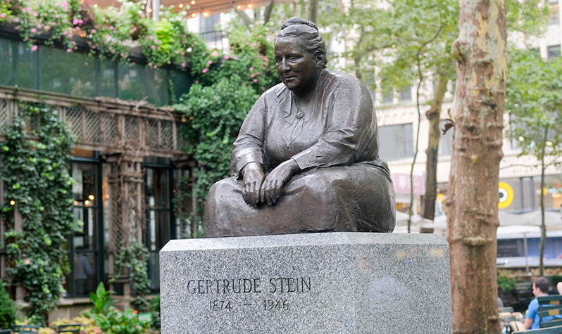 A bronze statue of Gertrude Ederle is located in Bryant Park. The statue depicts Gertrude Stein sitting, cross-legged atop a pedestal base that reads: Gertrude Stein, 1874-1946.