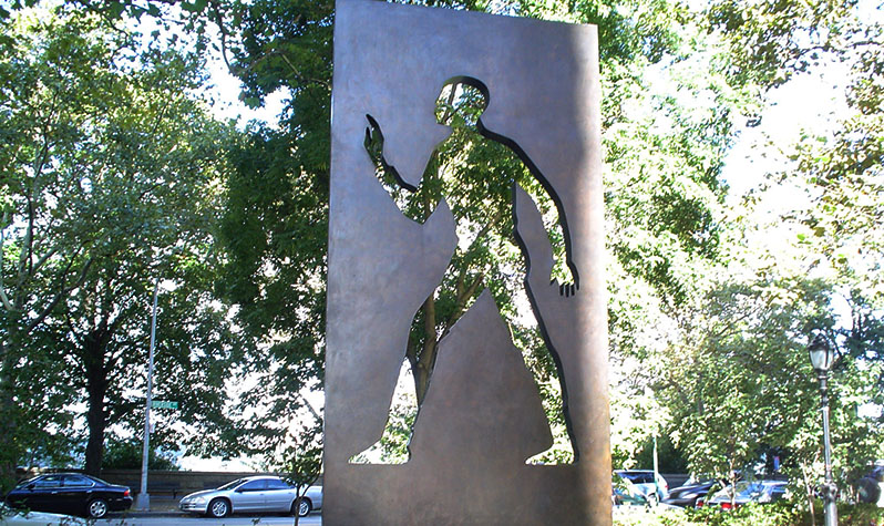 A bronze monolith featuring a hollow silhouette  of a man, which is a nod to Ralph Ellison's "Invisible Man" novel and the theme of the book. Photo by Adrian Sas