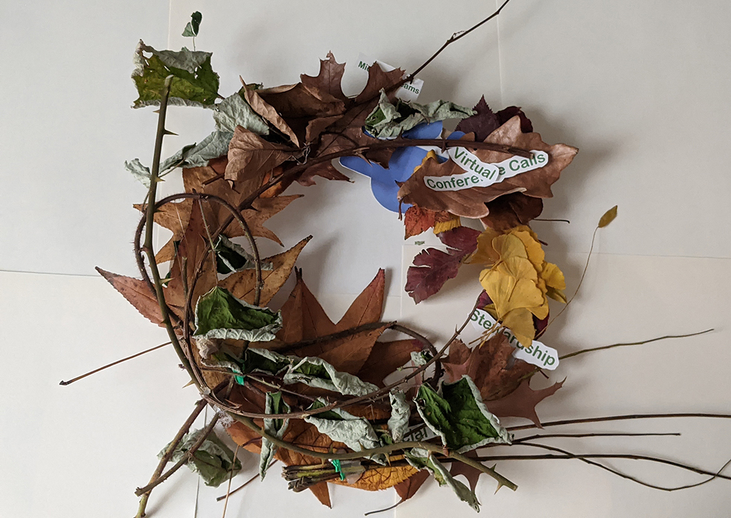 The words virtual, conference calls, and stewardship are arranged among leaves and twigs in their fall foliage to form a wreath