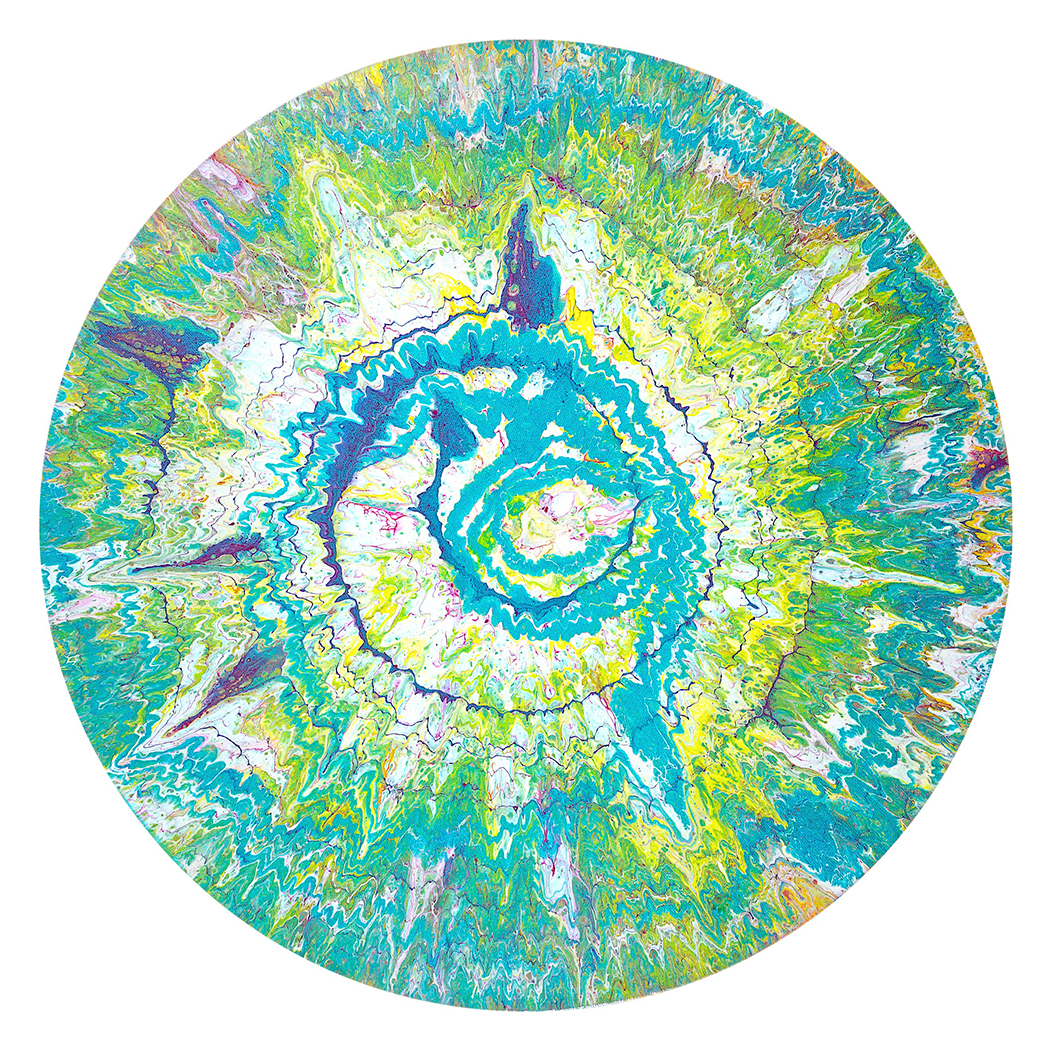 A splash of green, blue, white, yellow, lavender colors is captured in a circular form