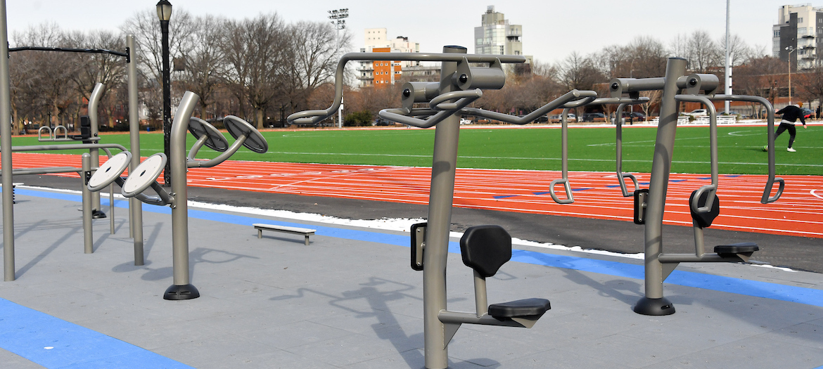 fitness equipment alongside a running track