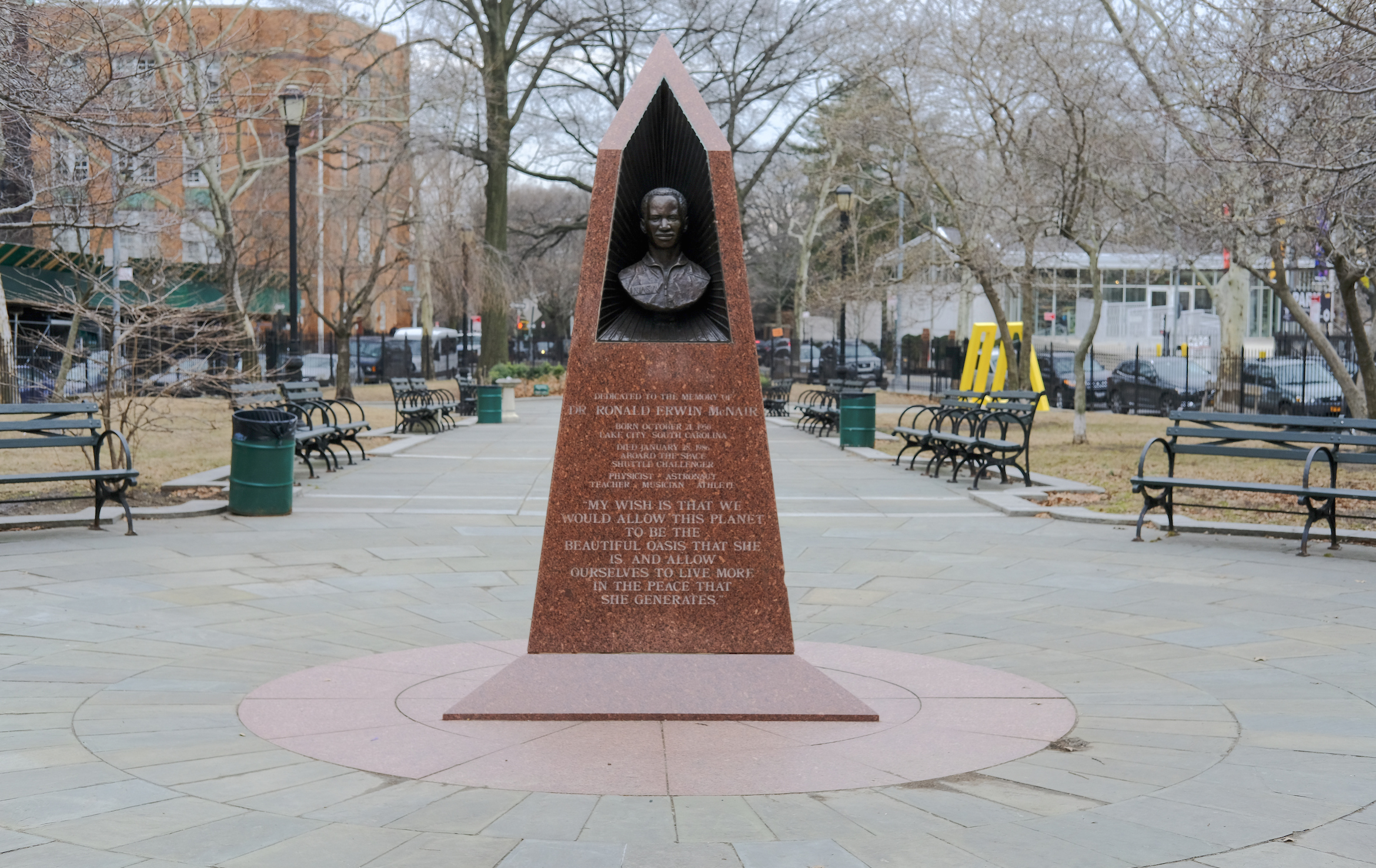 bust of Dr. Ronald McNair in a triangular shaped monument meant to depict a space shuttle. The monument stands at a central point in the park