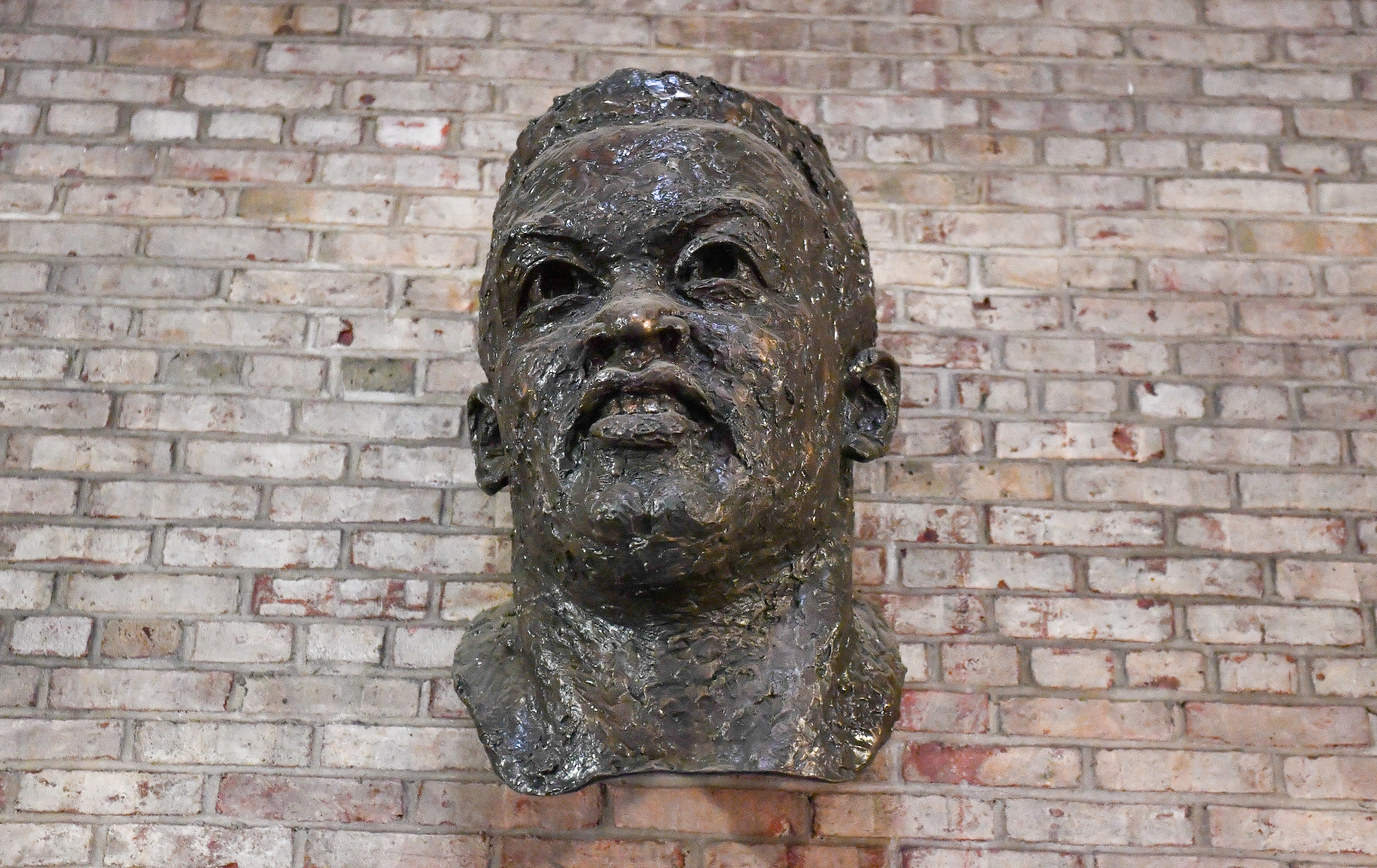 bust of Jackie Robinson against a brick wall in the rec center