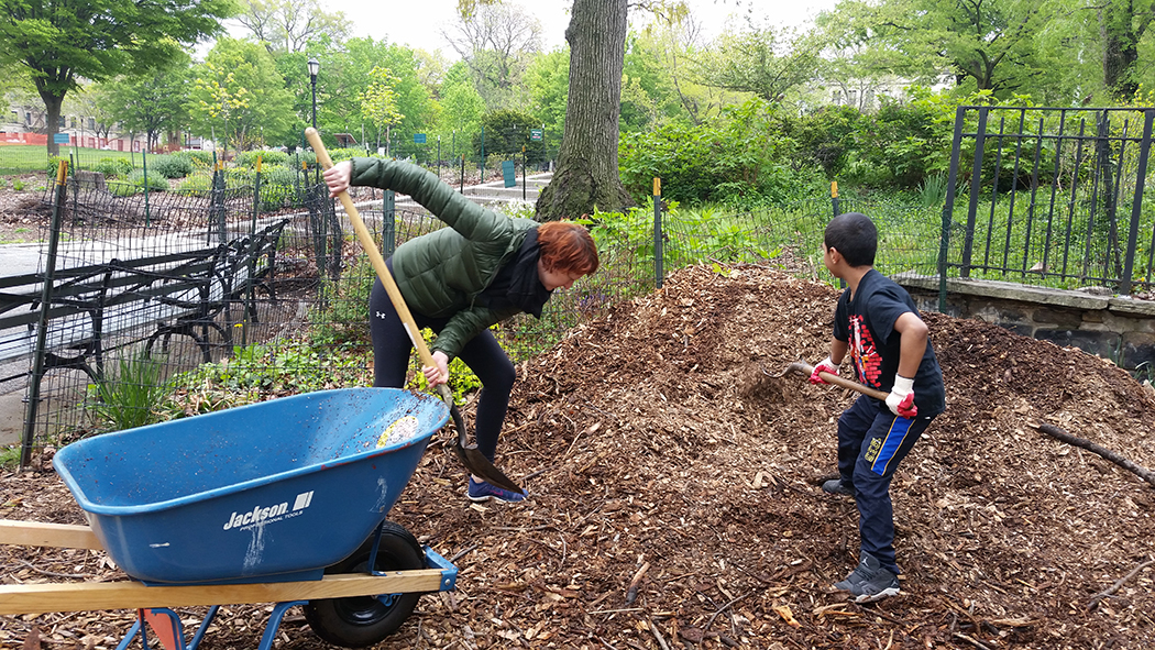 Kids shovel up mulch