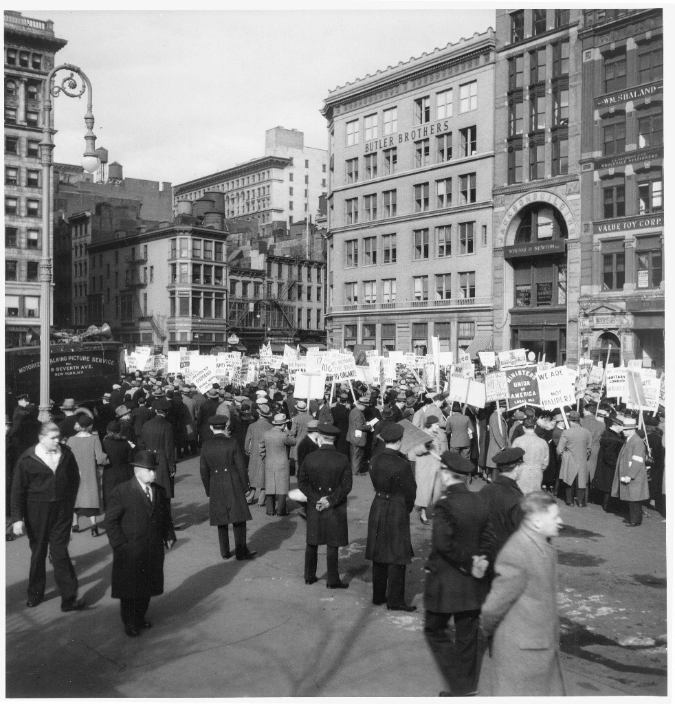 Union Square, Mass rally of the jobless, with barricading policemen in foreground