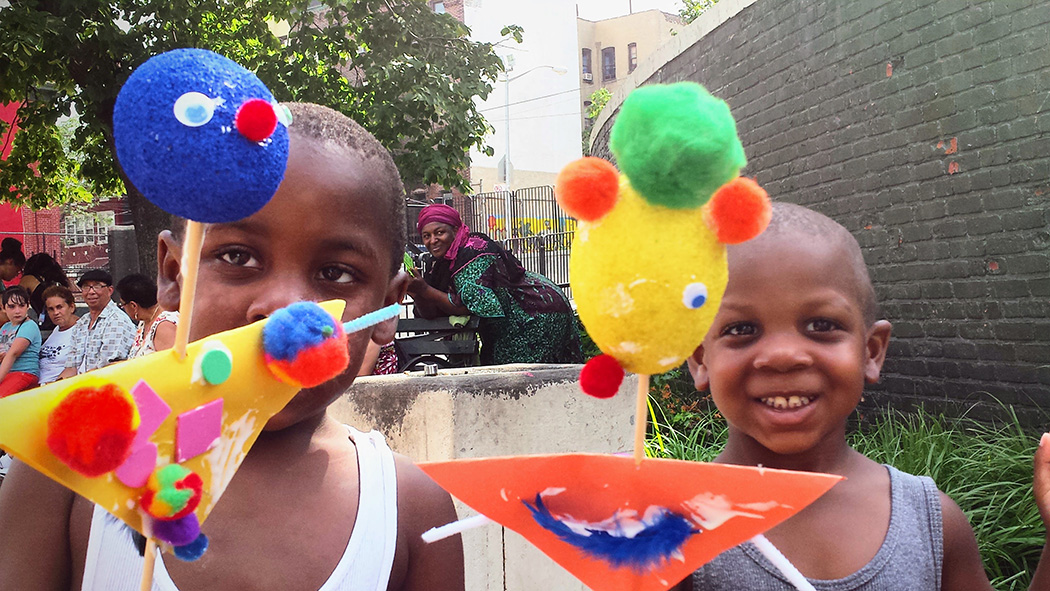 Kids show of their craft work in the park