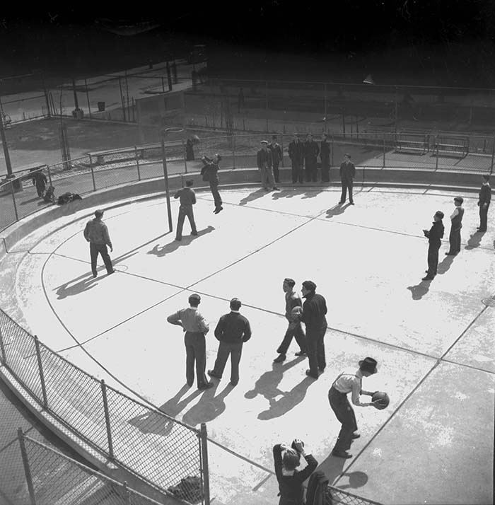 black and white archival image of a basketball game