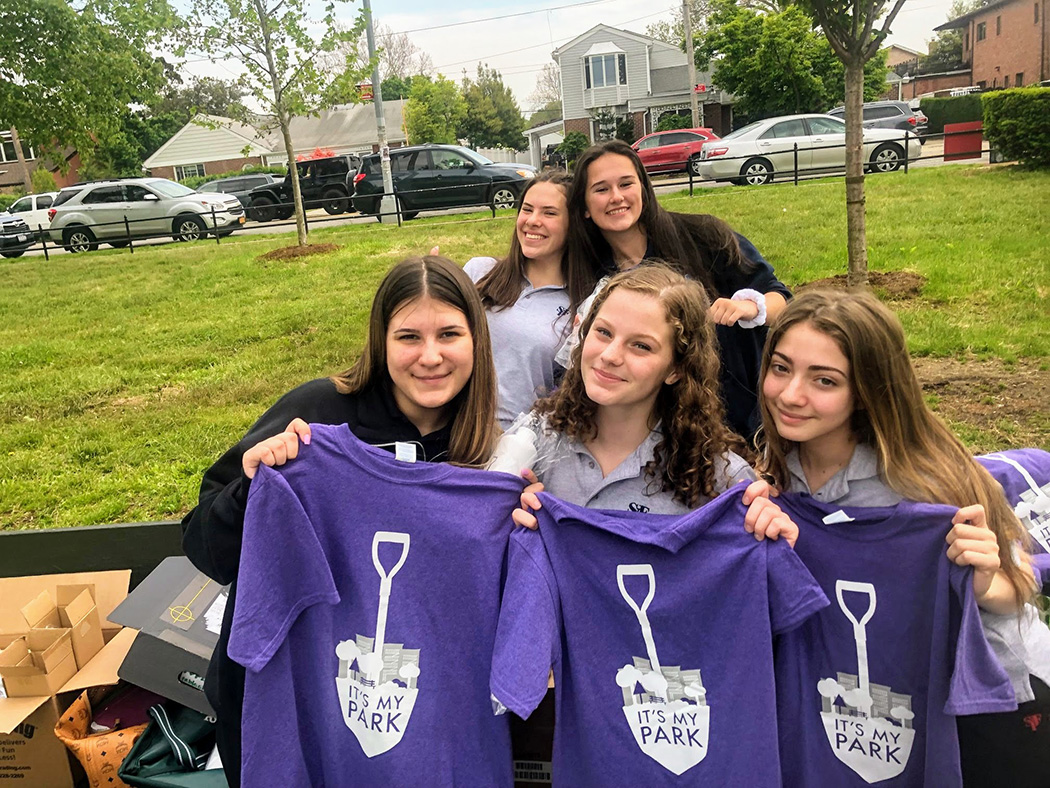 Teens pose with their It's My Park tshirts