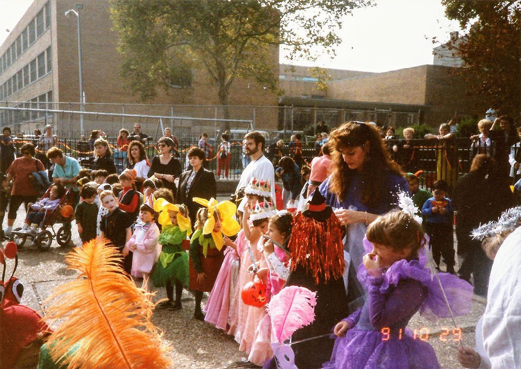 Kids in costume line up in the park