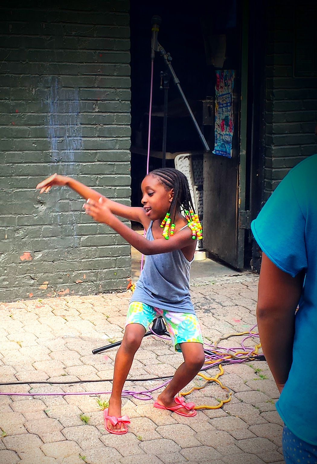 A kid dances in a playground