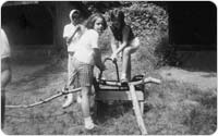 Girl Scouts cutting wood