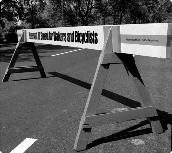 A police barricade in Central Park blocks motor vehicles from entering an area reserved for pedestrians and bicyclists, September 26, 1969.