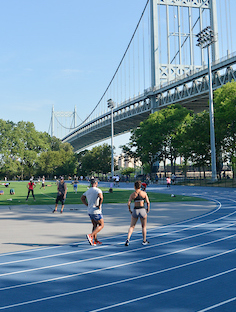 runners use the track in Astoria Park