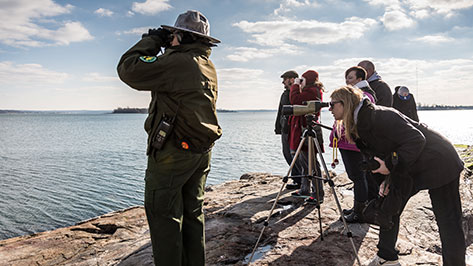 ranger brings group to go birding