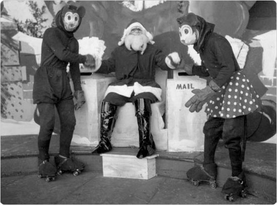 Santa shaking hands with Mickey and Minnie Mouse at the Central Park Bandshell, December 1935. Courtesy of Parks Photo Archive, Neg. 6736.