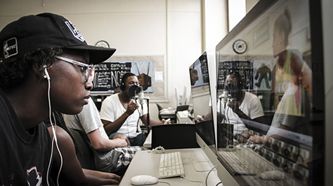 teens use computer software and mics to create media