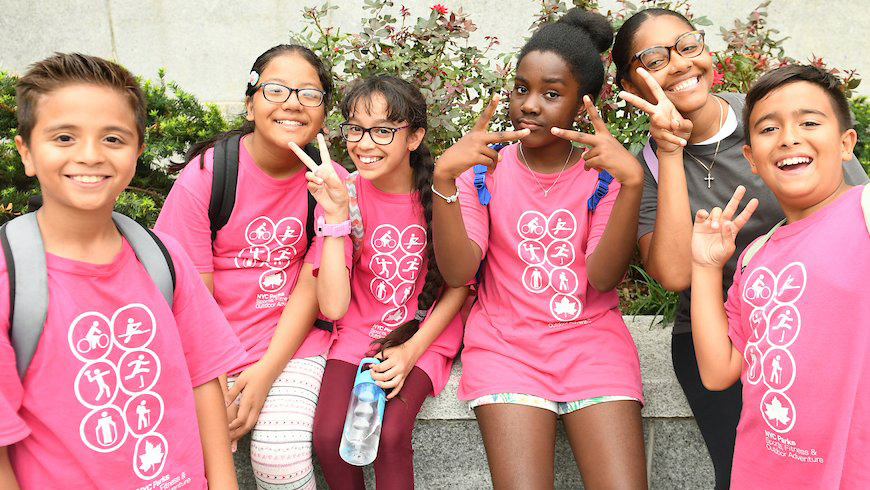 kids at a summer camp pose for a photo