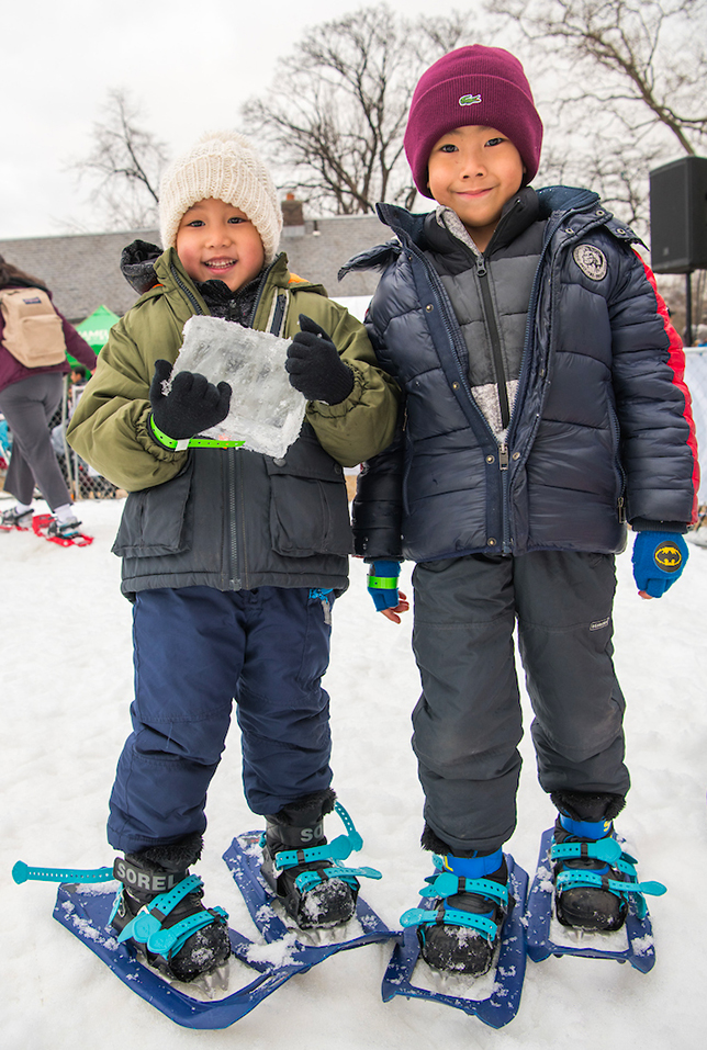 Kids pose for a photo in snowshoes as they prepare to play at Winter Jam.