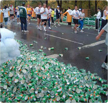 Piles of empty cups amass along the marathon route. During the race, volunteers hand out 2,250,000 paper cups to thirsty runners. Photo by Malcolm Pinckney, November 4, 2001.