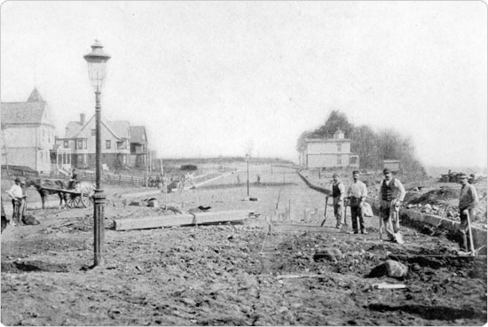 Image of Workers starting the extension of New York's Eastern Parkway around 1896. Olmsted & Vaux's tree–lined parkways incorporated nature into the plans for additional roads to accommodate increased population.