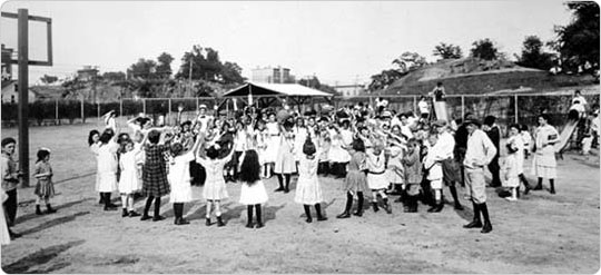 Girls playing, in St. Mary?s Park, the Bronx. Early 1900s. Underwood and Underwood/New York City Parks Photo Archive.