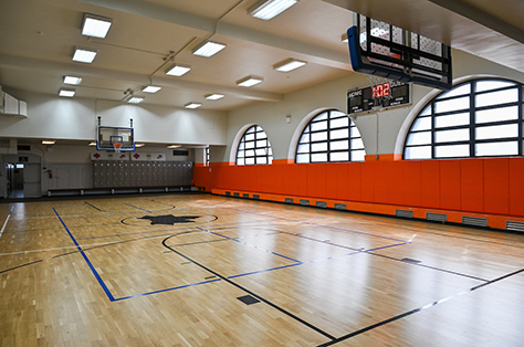 A clean and brightly lit empty gymnasium.