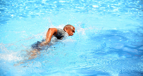 a swimmer swims freestyle stroke in the pool