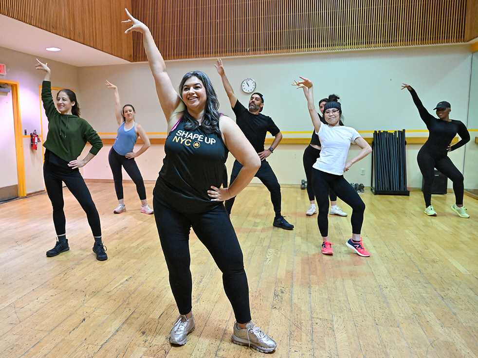 an instructor leads a dance class