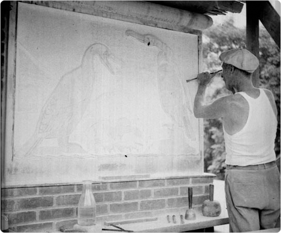 A sculptor works on bas reliefs for the Central Park Zoo, July 18, 1934. Courtesy of Parks Photo Archive, Neg. 3500.