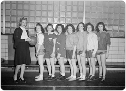 1945 Betsy Head girls basketball team poses at a tournament (March 9, 1945).