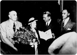 Parks Commissioner Robert Moses chats with Kate Wollman at the dedication of Wollman Rink in Central Park, October 11, 1949.