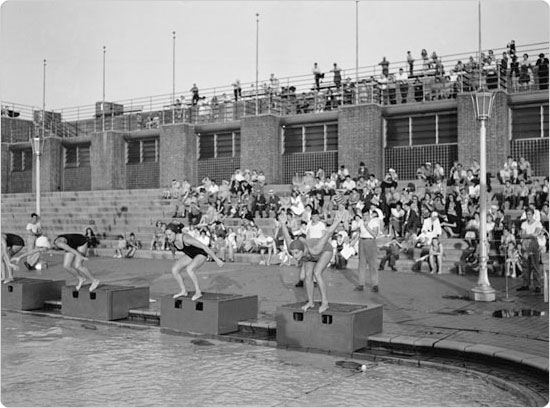 Swimmers on the starting block at an Astoria Pool swim meet, August 17, 1943. Courtesy of Parks Photo Archive, Neg. 22587.