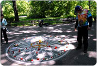 A visitor inspects the monument and contemplates its meaning