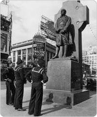 Three sailors gaze up at the Father Francis Patrick Duffy statue in Duffy Square, October 12, 1941. Courtesy of Parks Photo Archive, Neg. 20990.2.