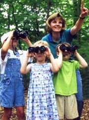 image of kids birdwatching in woods