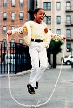 Young girl skips rope in Nelson Playground, Bronx